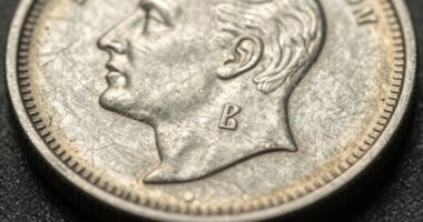 inspecting coin edges carefully